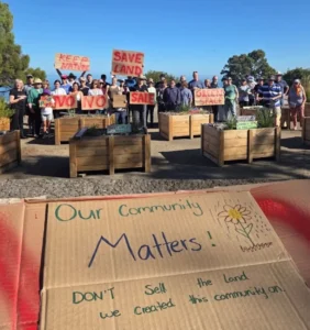 Residents gather to protest the proposed sale of McConnell Reserve land